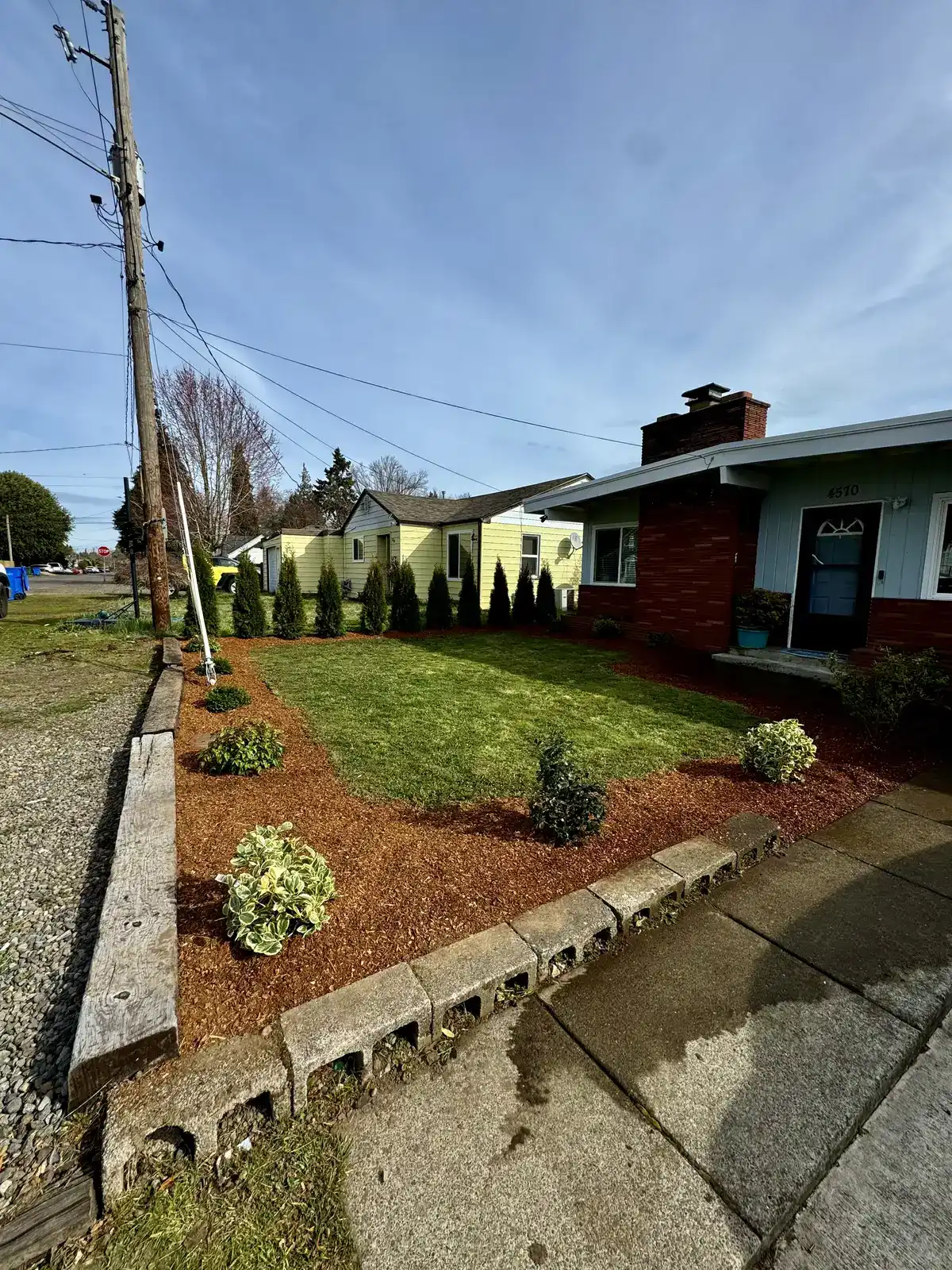 Front yard makeover with arborvitae sod and mulch by CreekView Landscape in Oregon