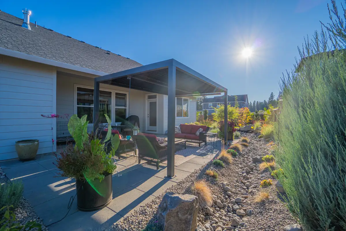 Modern pergola outdoor living space by CreekView Landscape in Oregon
