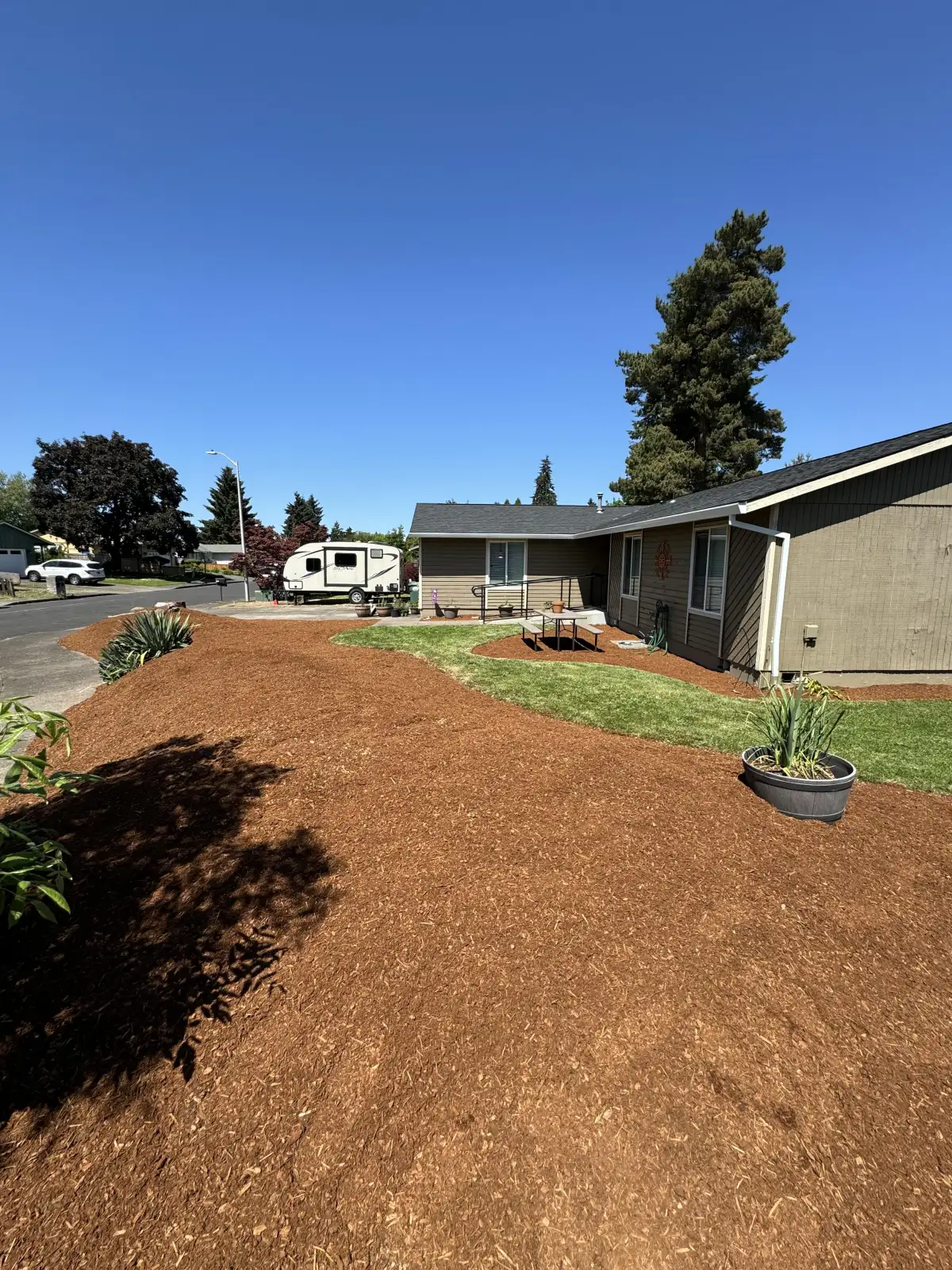 Mulch installation in Oregon landscape beds by CreekView Landscape