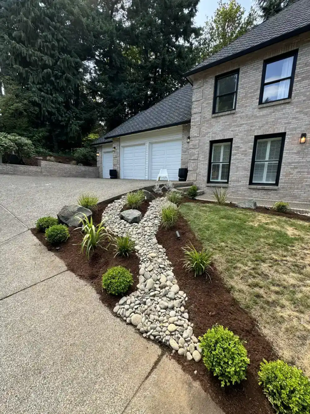 Fresh bark mulch installation around landscape beds in Wilsonville Oregon