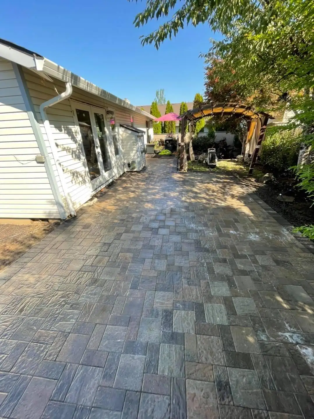 Herringbone paver walkway with brick border by CreekView Landscape