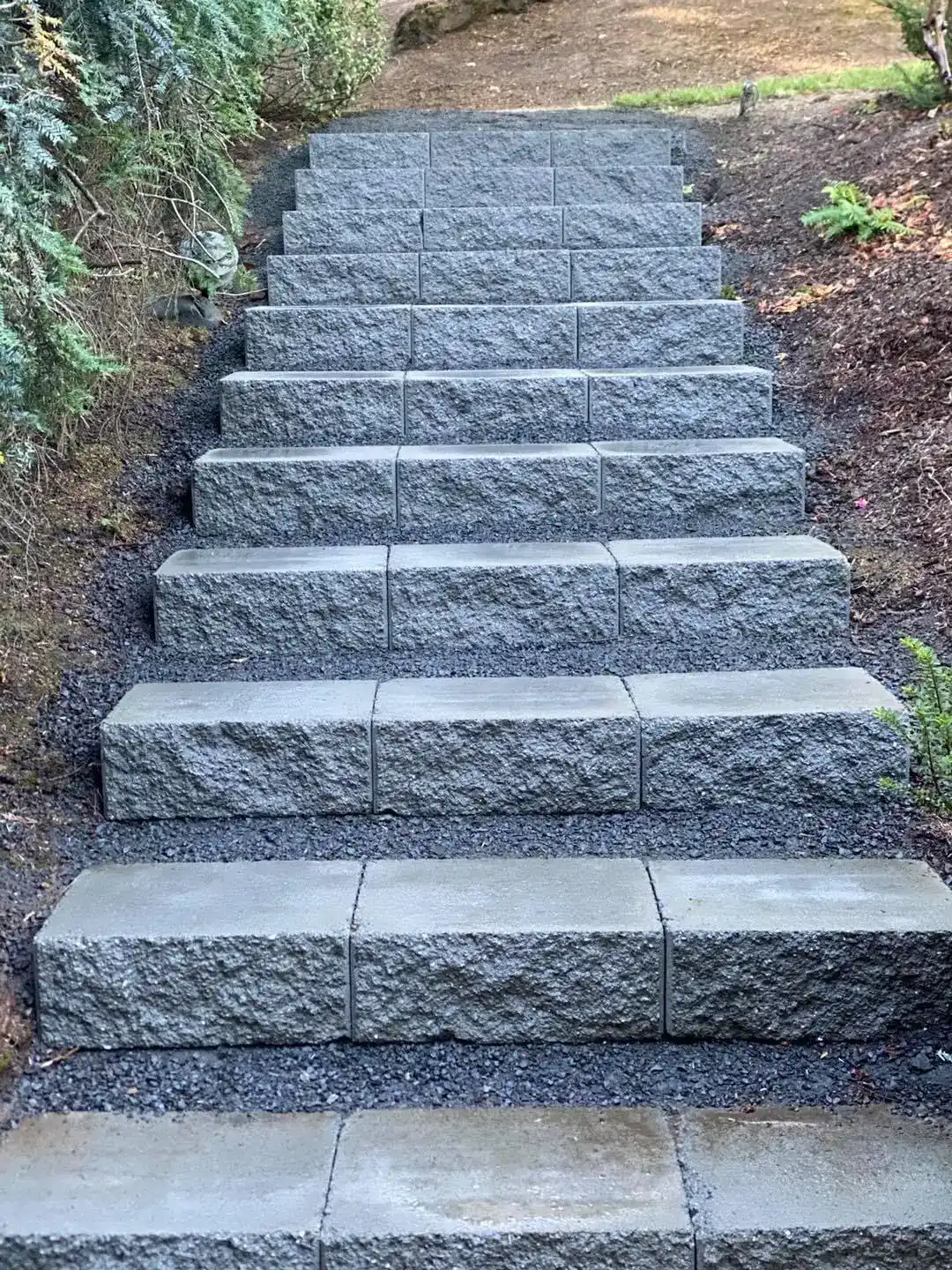 Paver patio with retaining wall by CreekView Landscape