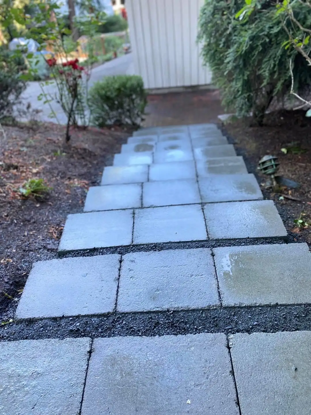 Paver patio with retaining wall by CreekView Landscape
