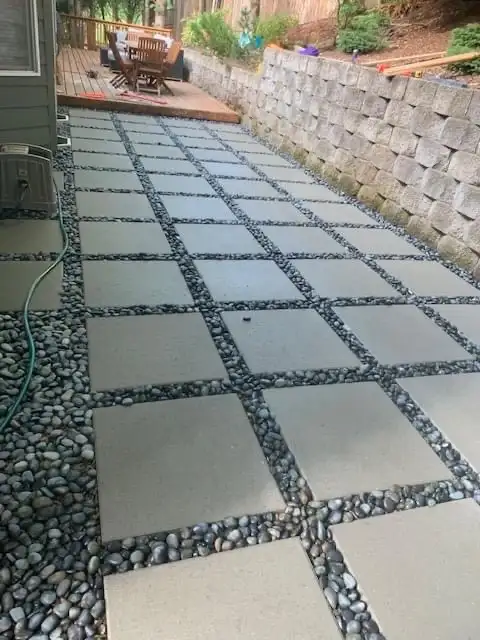 Pavers along retaining wall by CreekView Landscape in Oregon